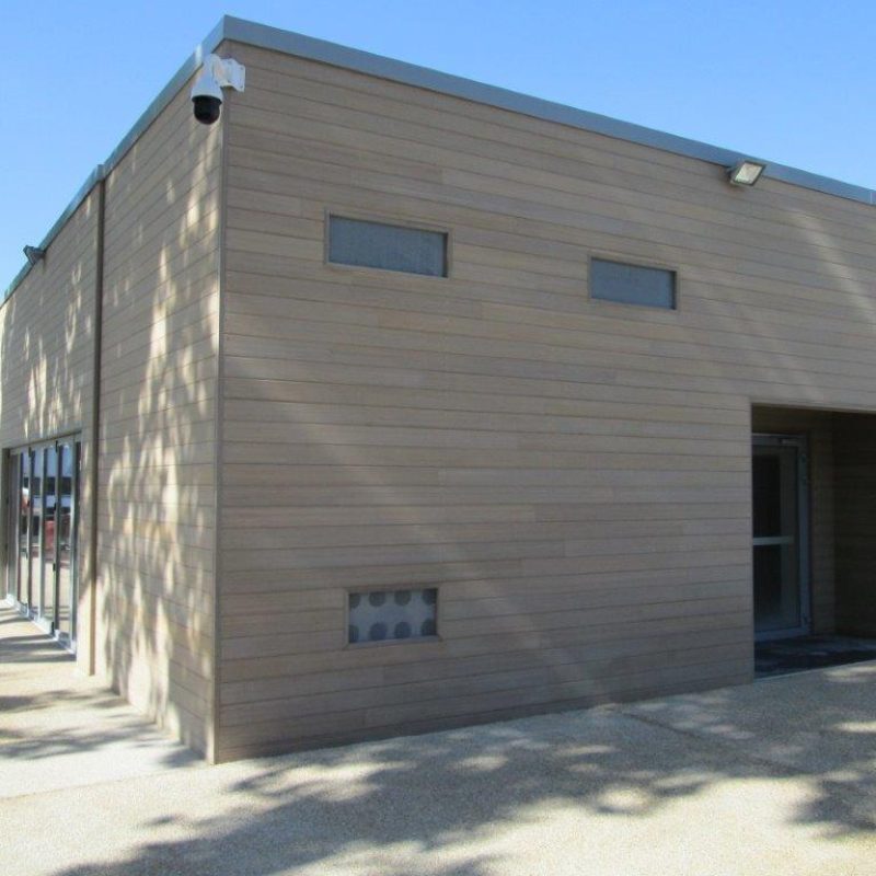 Copy of Bamdura-BAMBOO-siding-installed_gray_building-11302023